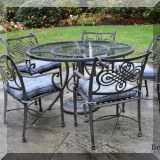 L02. Glass top metal patio table with 5 chairs. 